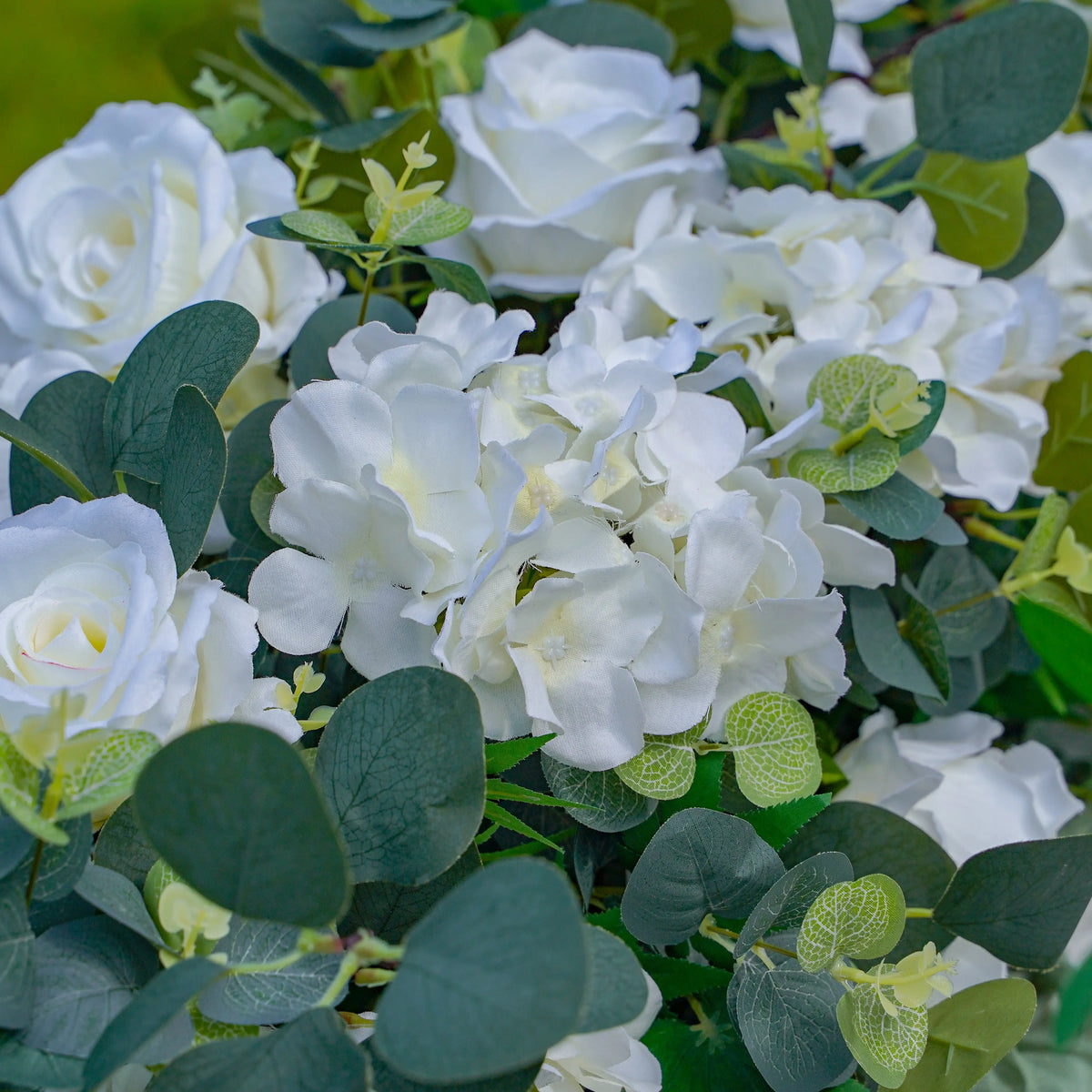 White floral table runner with hydrangea roses and eucalyptus leaves