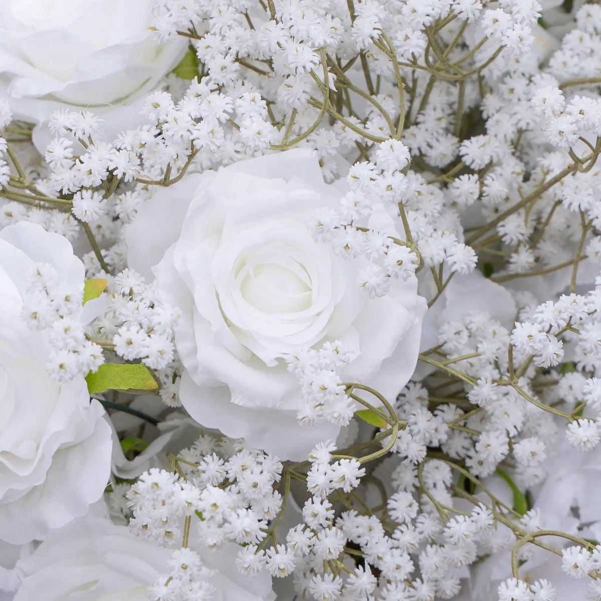 Close-up of white rose and baby's breath artificial flower runner