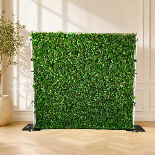 Greenery flower wall panels arranged for an event backdrop