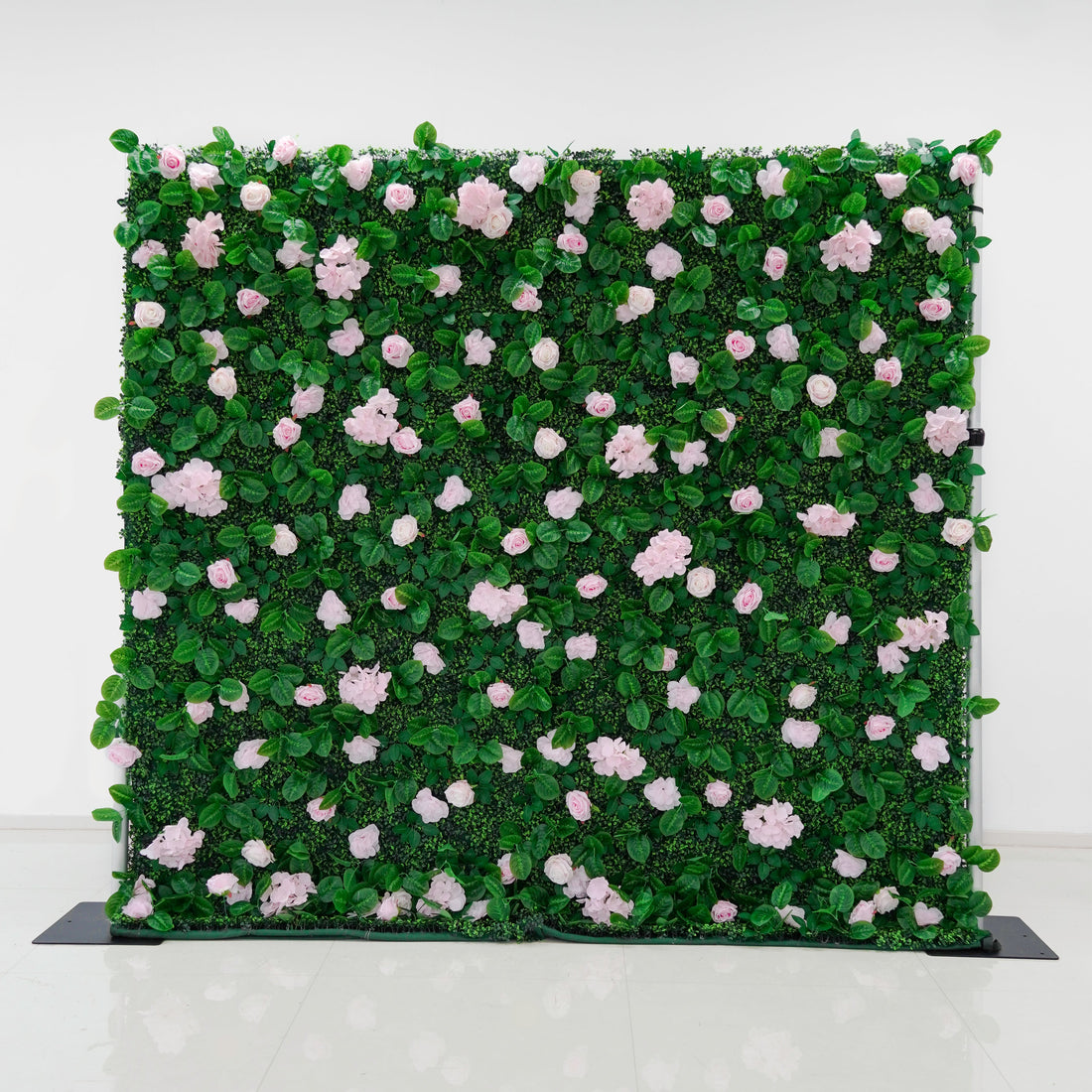 Pink rose flower wall photographed as an event backdrop
