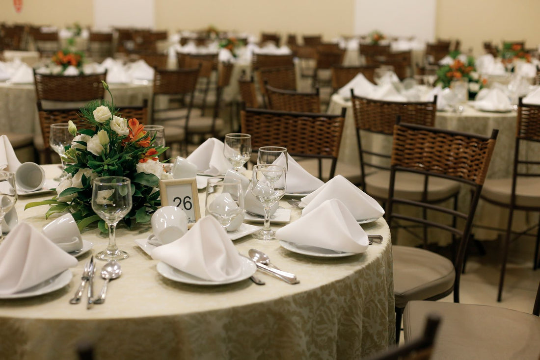 Wedding reception table with floral centerpiece and table setting