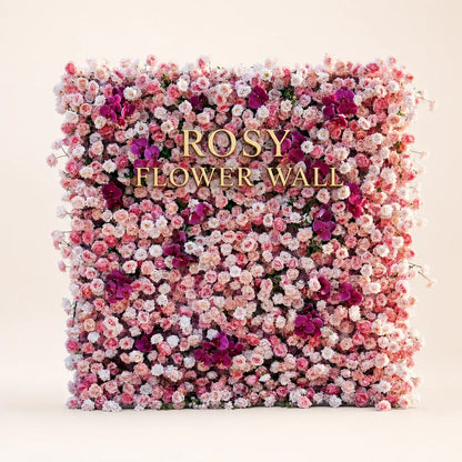 Luxury 4D pink and purple orchid silk flower wall in warm white studio with gold ROSY FLOWER WALL logo