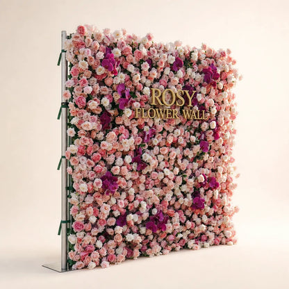Luxury 4D pink and purple orchid silk flower wall opposite angled view in warm white studio with gold ROSY FLOWER WALL logo