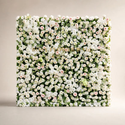 3D white rose hydrangea and soft blush flower wall in warm ivory studio with gold Rosy Flower Wall logo