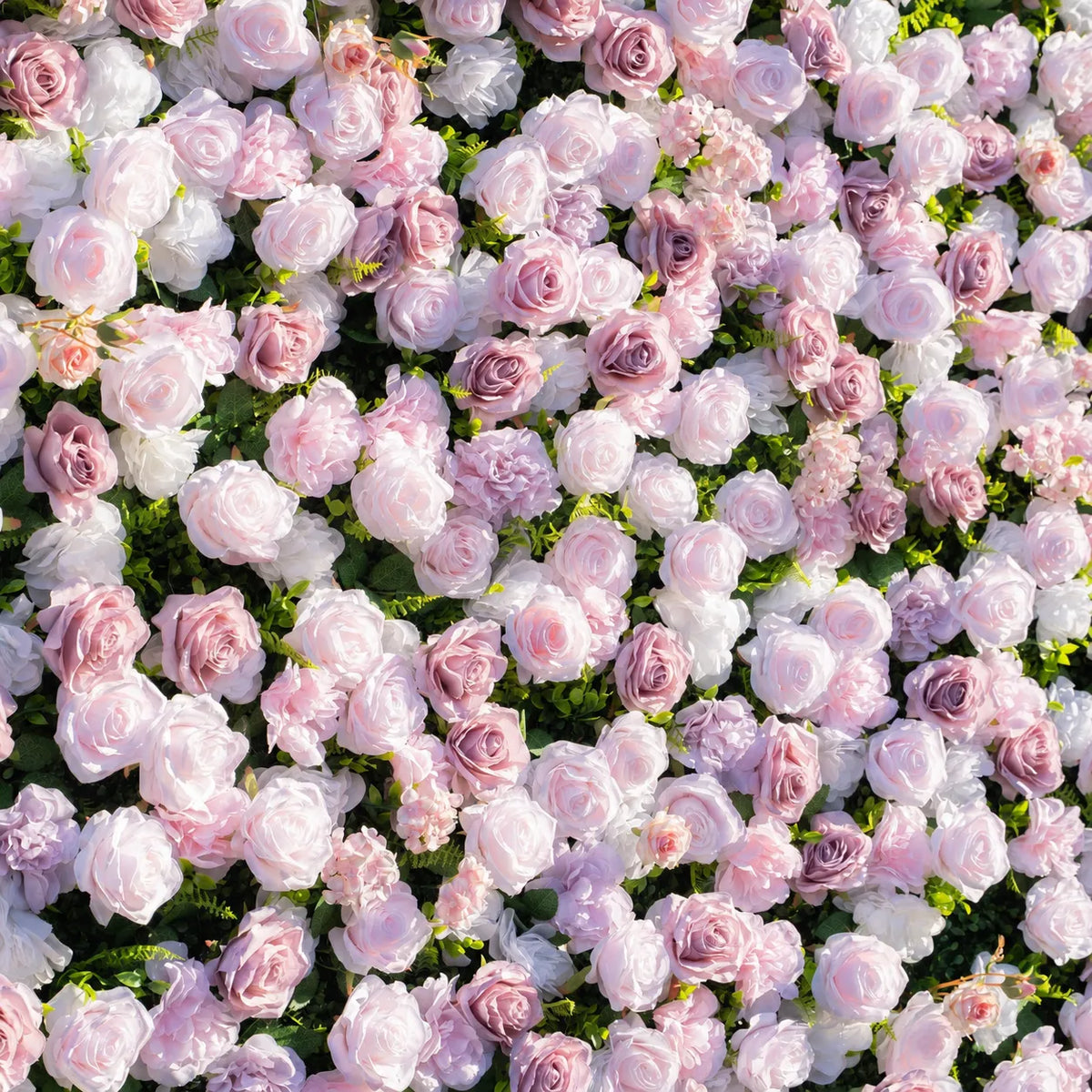 Close-up detail of pink white and mauve silk roses on 3D artificial flower wall
