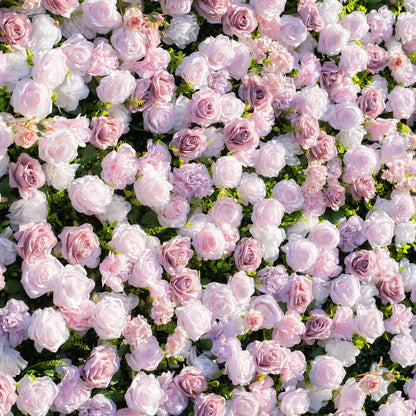 Close-up detail of pink white and mauve silk roses on 3D artificial flower wall