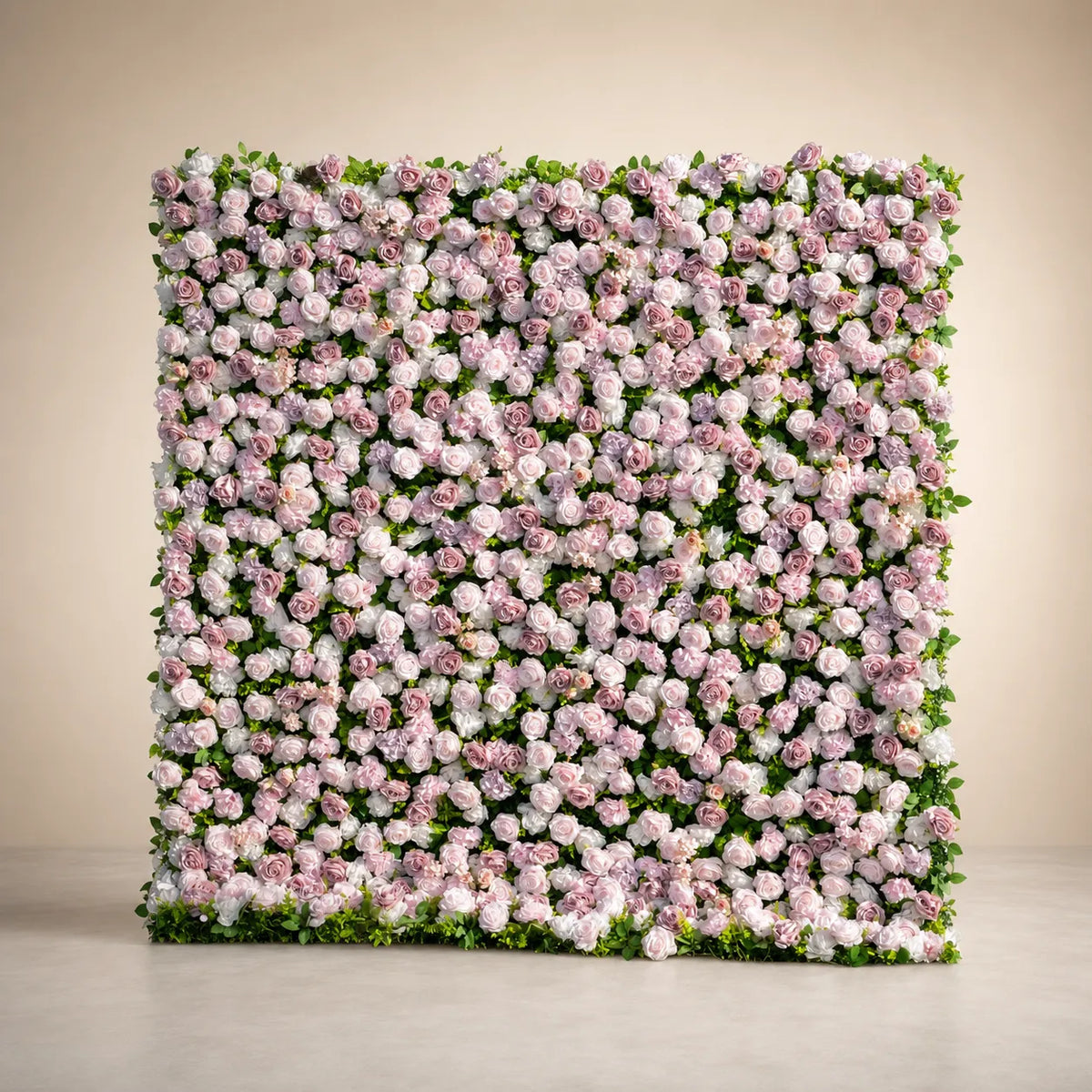Angled full view of pink and white 3D artificial flower wall backdrop in warm studio