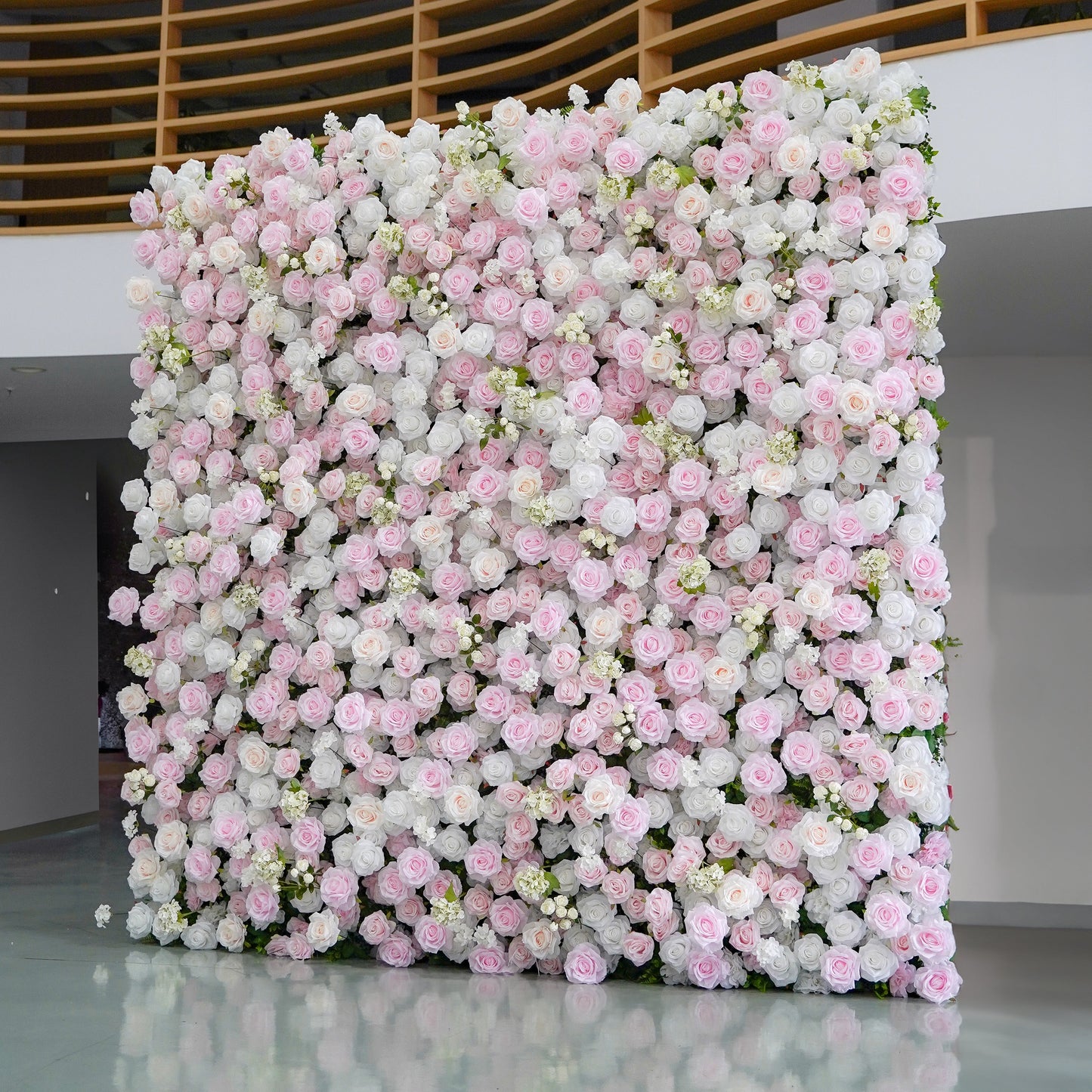 White and blush 5D silk flower wall backdrop, angled side view in an indoor venue