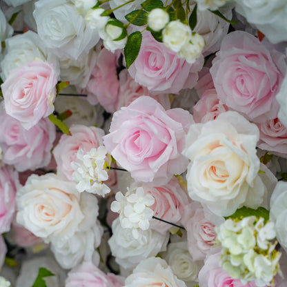 Close-up of white and blush silk flowers on the flower wall