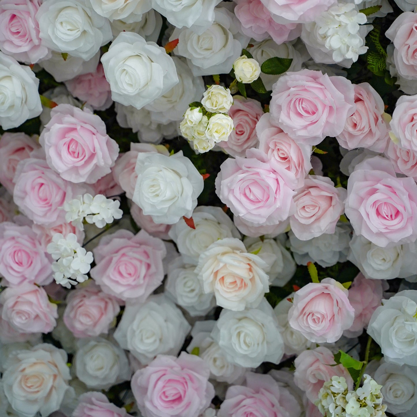 Close-up of white, pale-pink and medium-pink artificial flowers