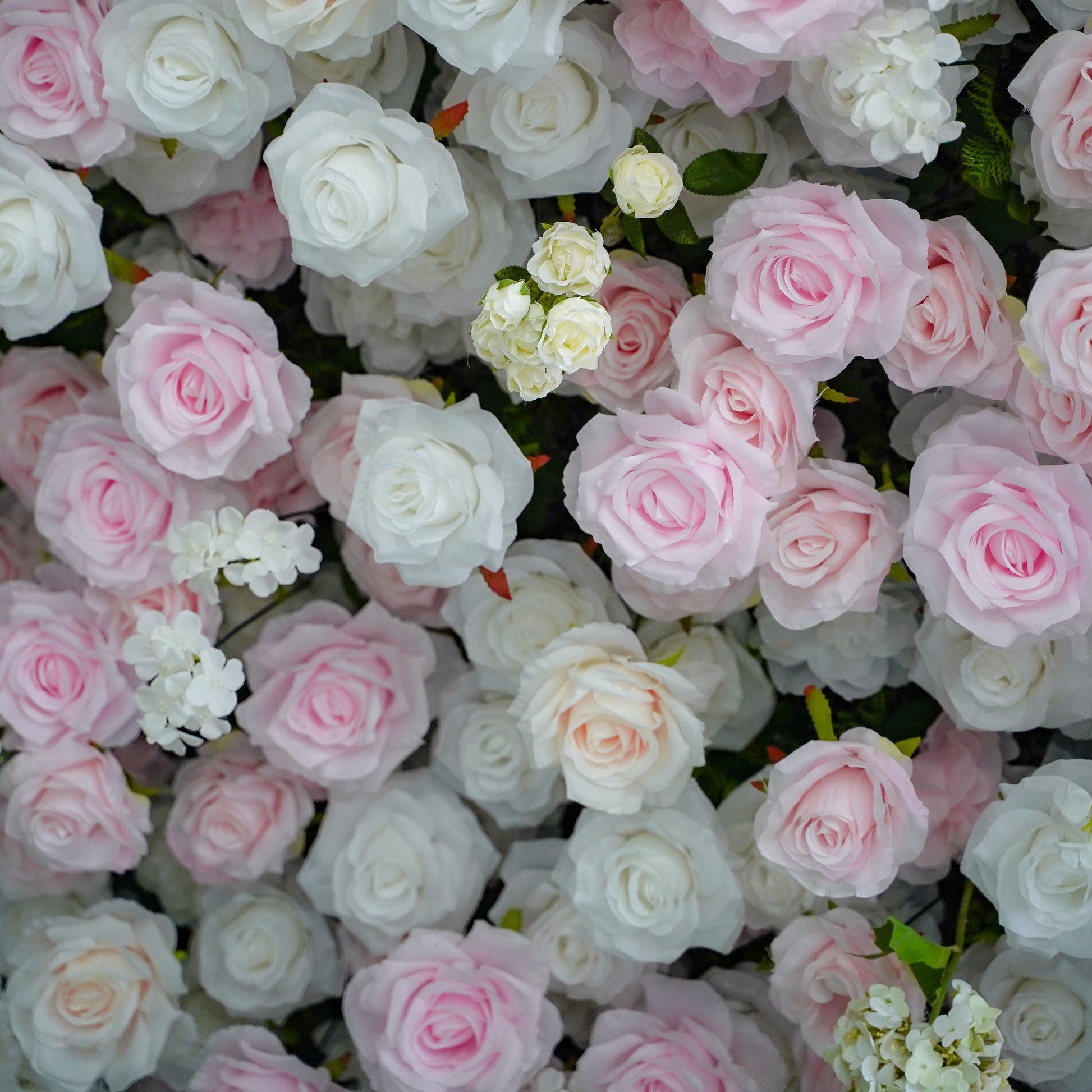 Close-up of white, pale-pink and medium-pink artificial flowers