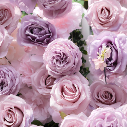 Detail of layered lavender and blush artificial roses on the flower wall