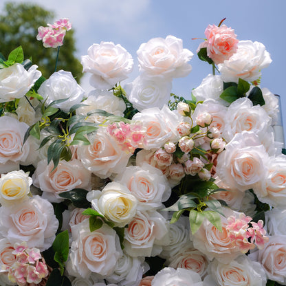 Detail of layered peach and white artificial roses