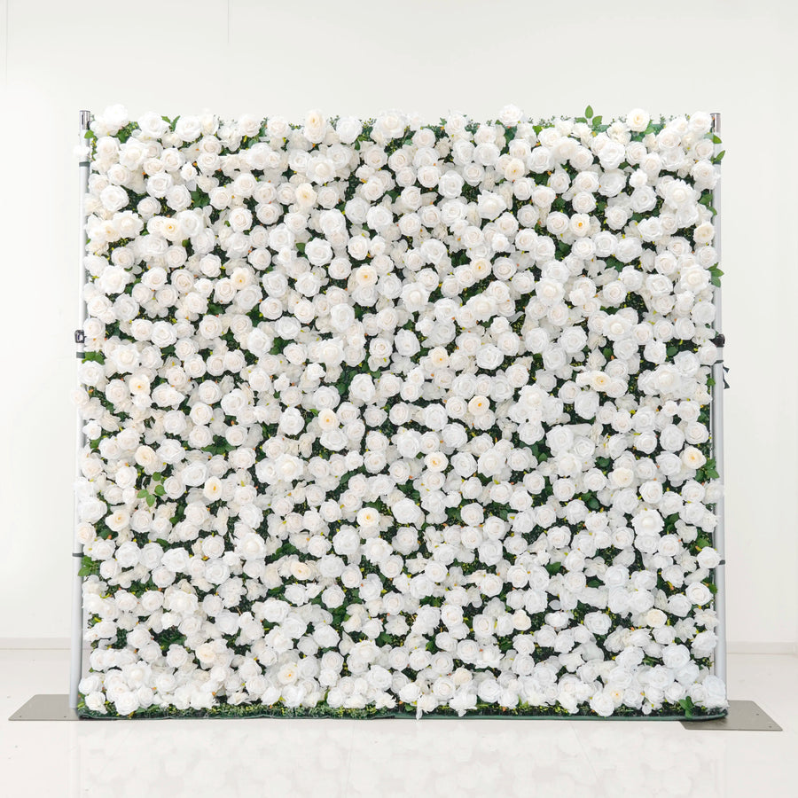 White artificial rose flower wall with green foliage visible between the blooms, front view