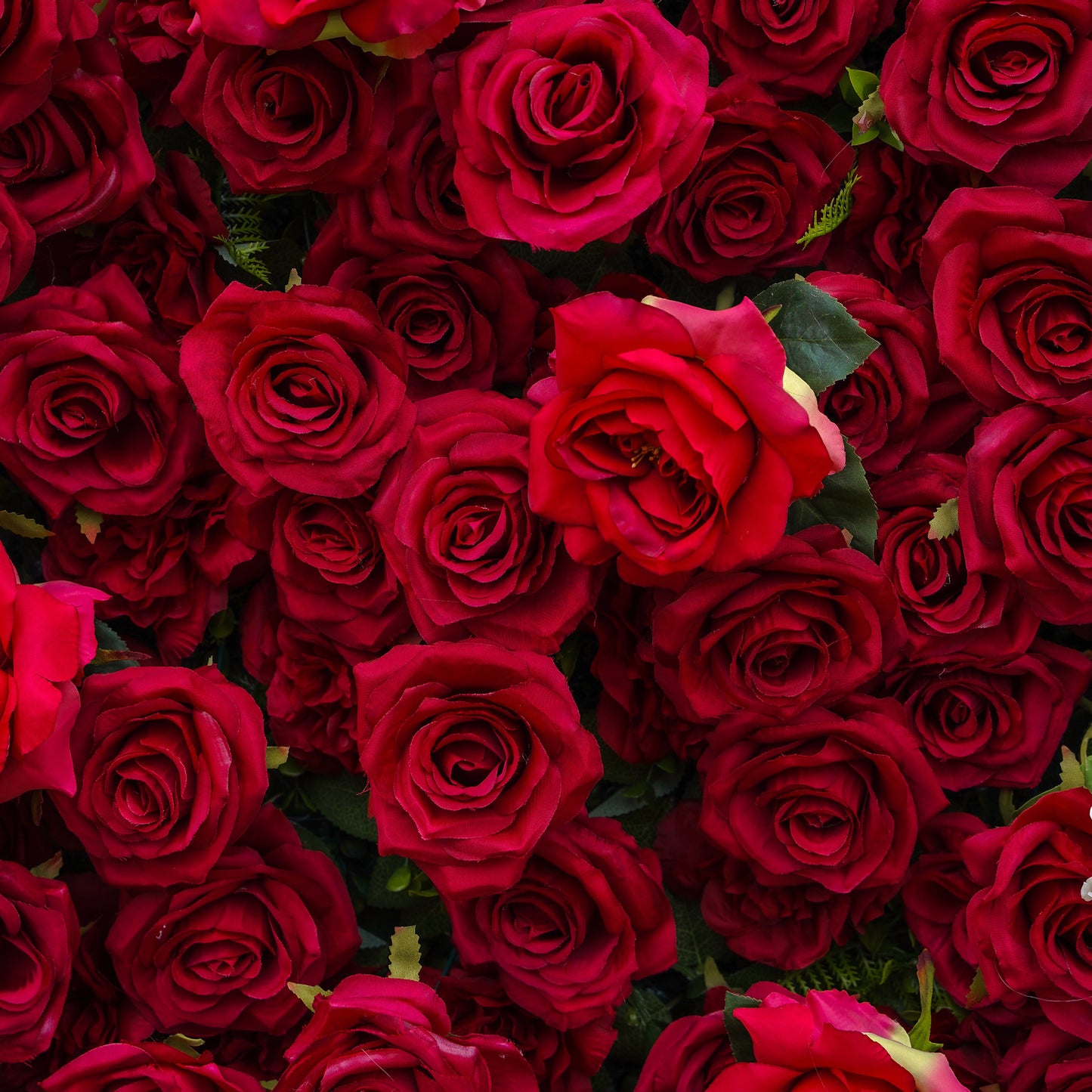 Detail of layered red artificial roses