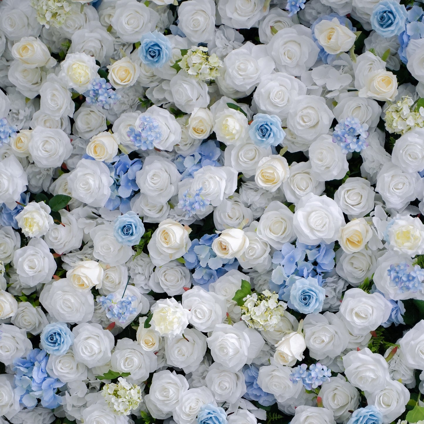 Close-up of blue and white silk flowers on the flower wall