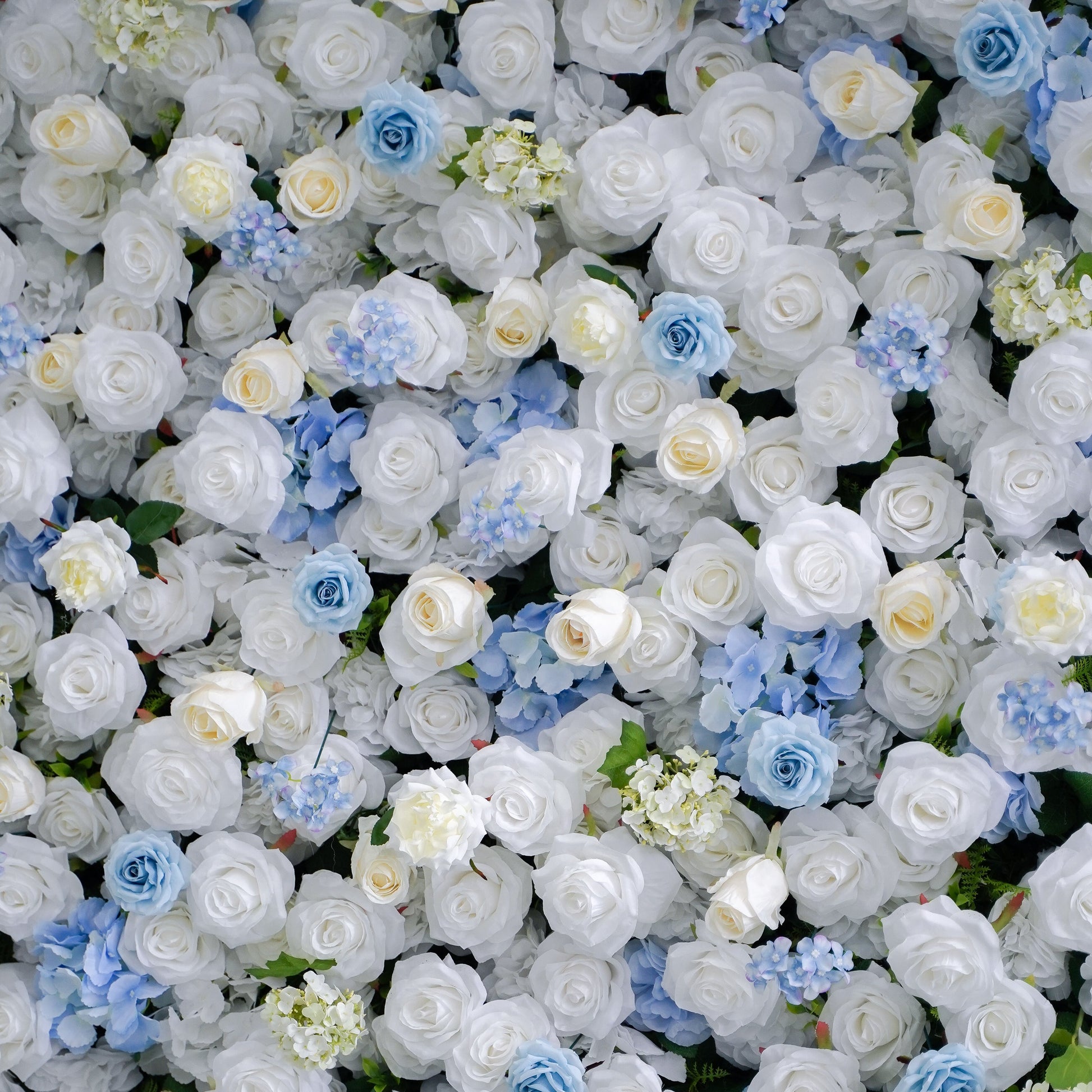 Close-up of blue and white silk flowers on the flower wall