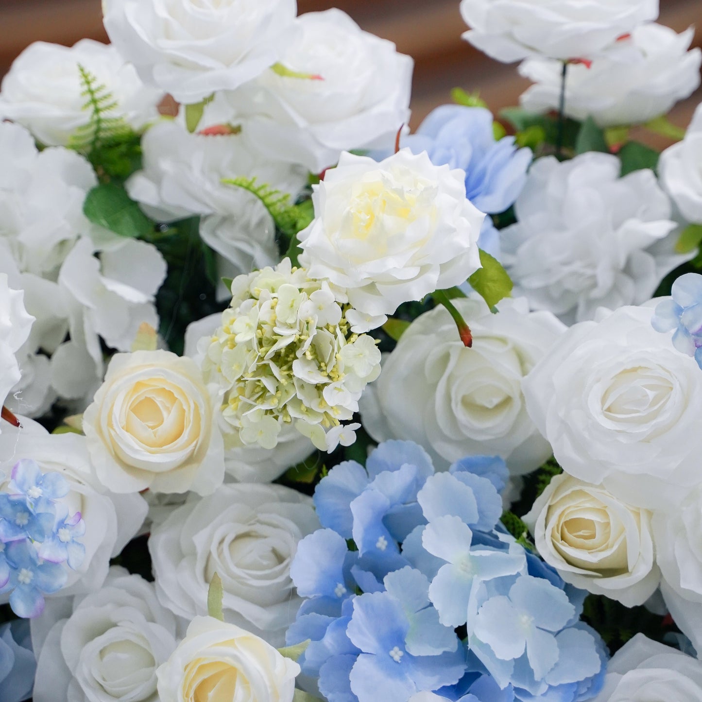 Detail of layered blue and white artificial roses