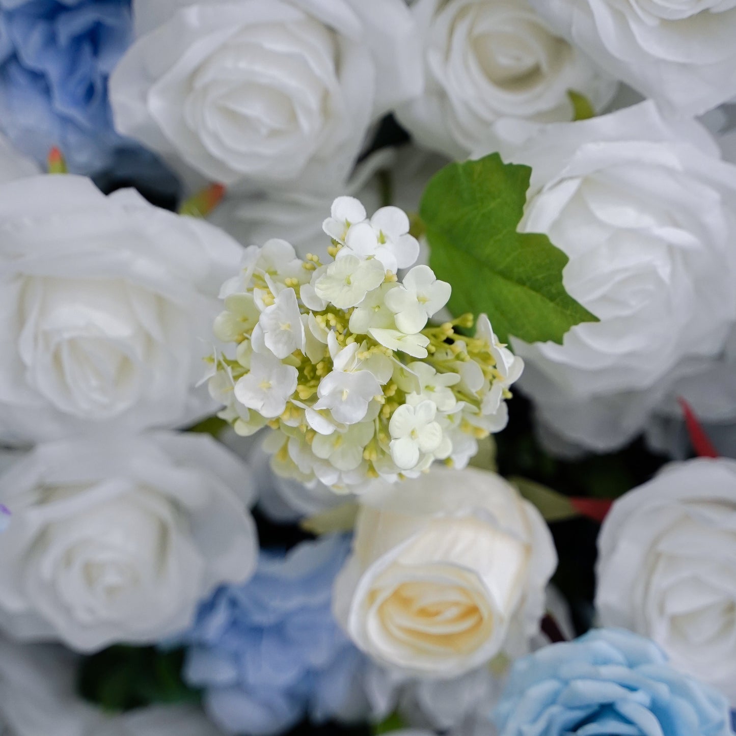 Detailed blue and white flower mix in the backdrop