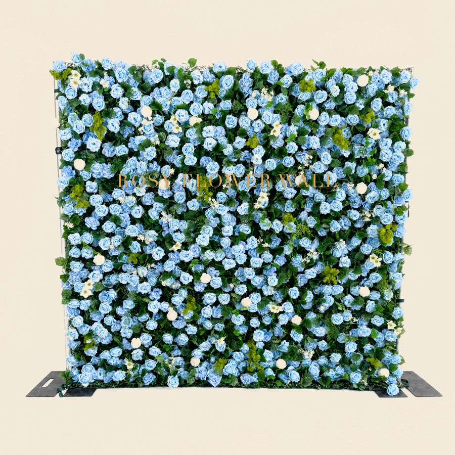 Blue rose flower wall on warm ivory studio background with gold Rosy Flower Wall logo