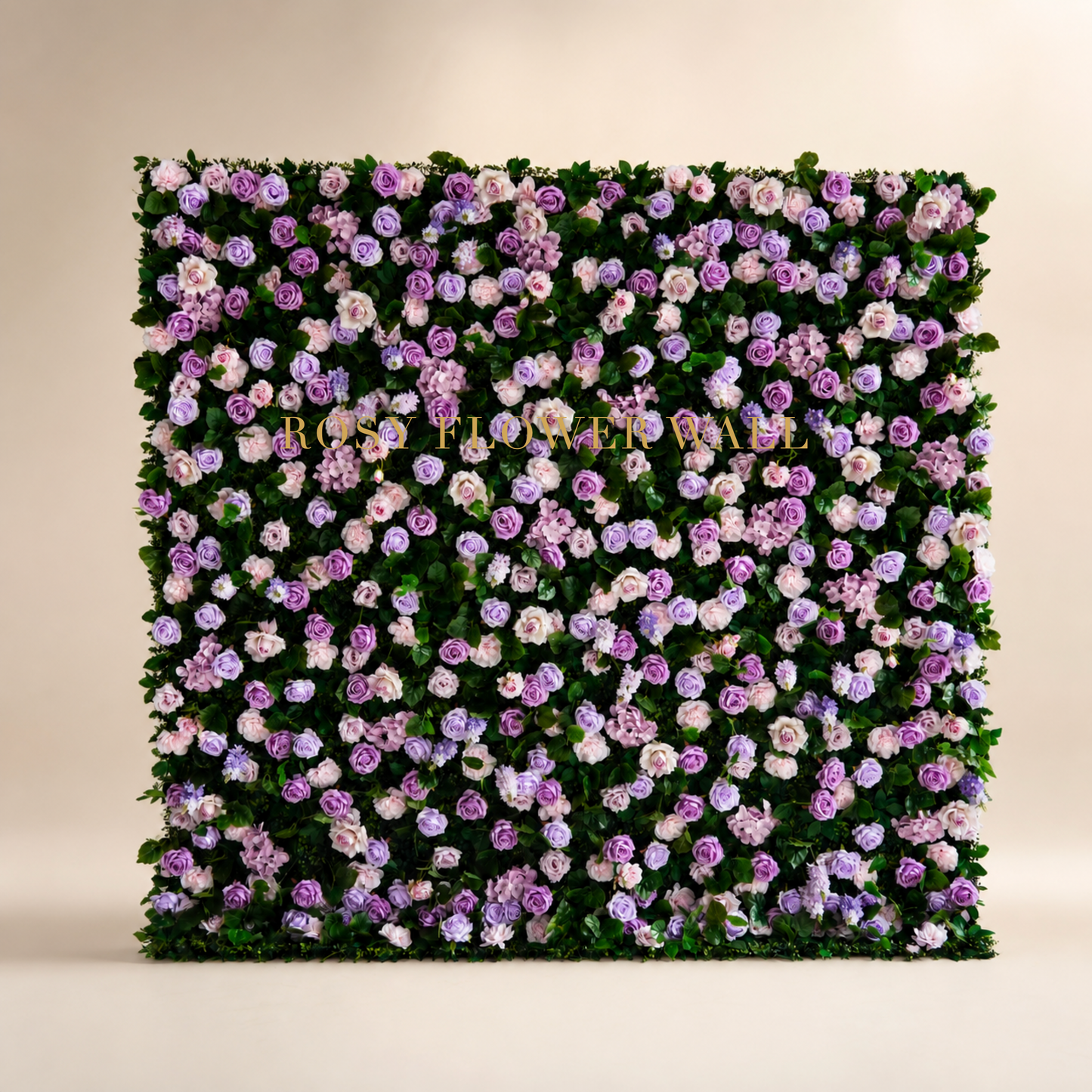 Blush lavender rose and greenery flower wall backdrop in warm ivory studio with gold Rosy Flower Wall logo