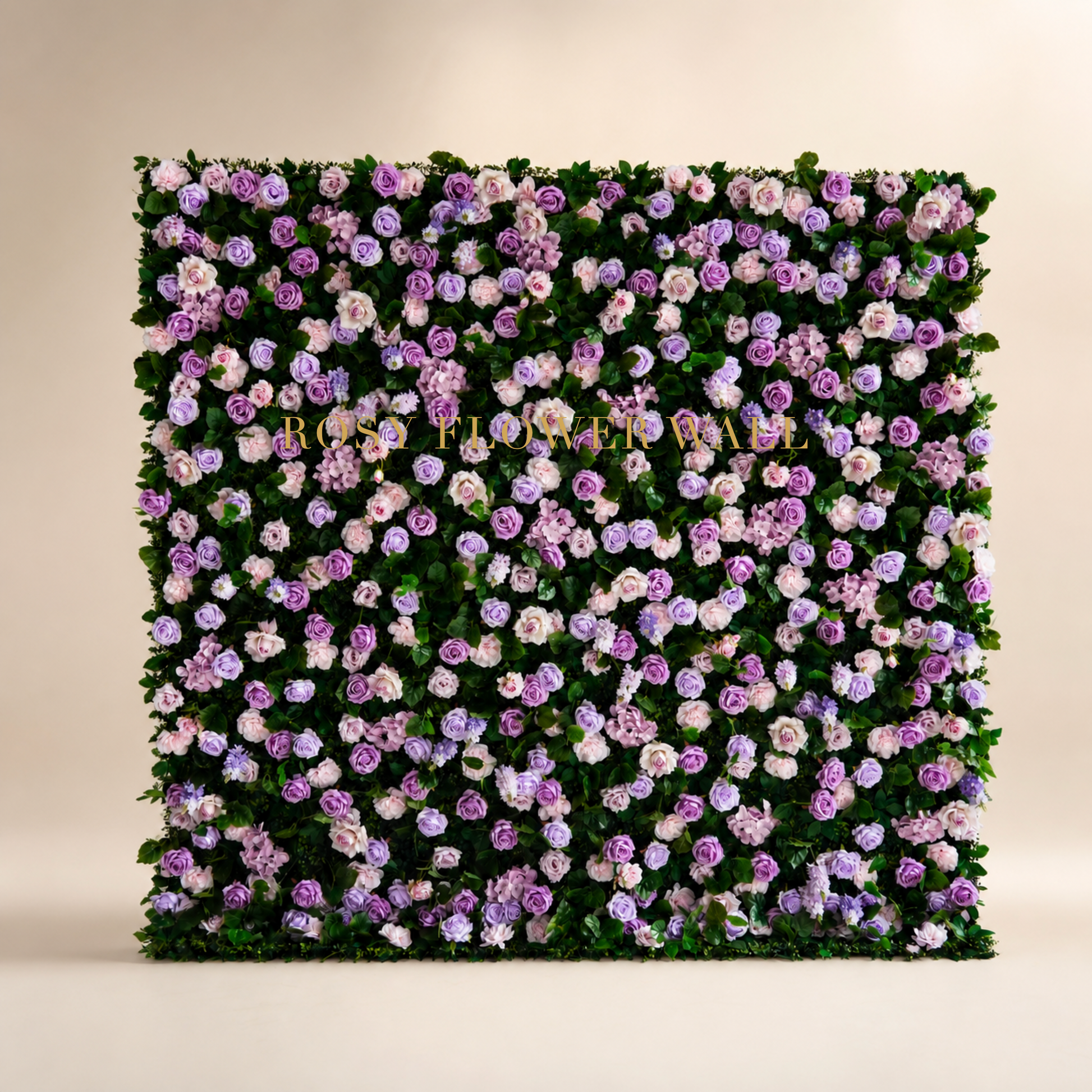 Blush lavender rose and greenery flower wall backdrop in warm ivory studio with gold Rosy Flower Wall logo
