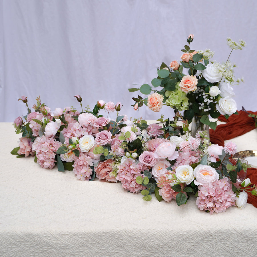 Blush pink hydrangea and rose artificial flower runner on a neutral studio table