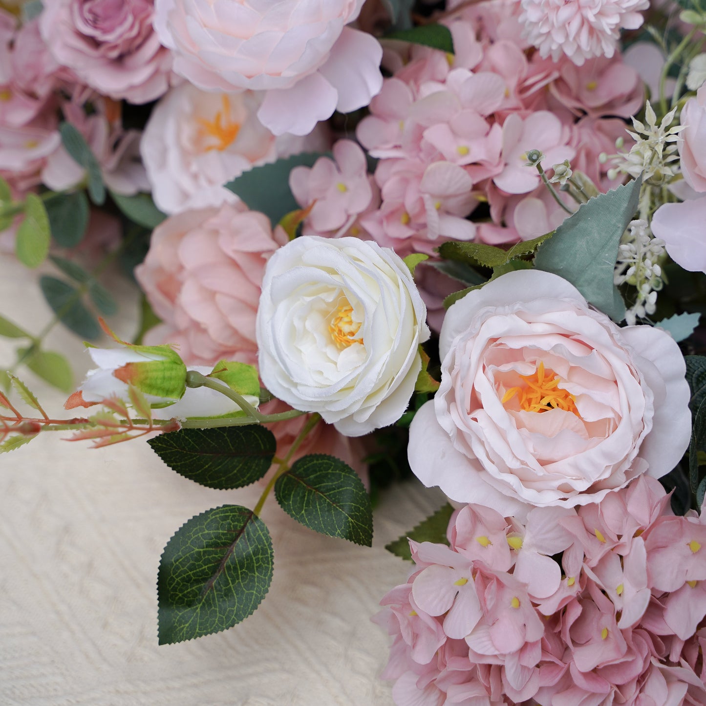 Close-up of blush pink hydrangea and white rose flower runner