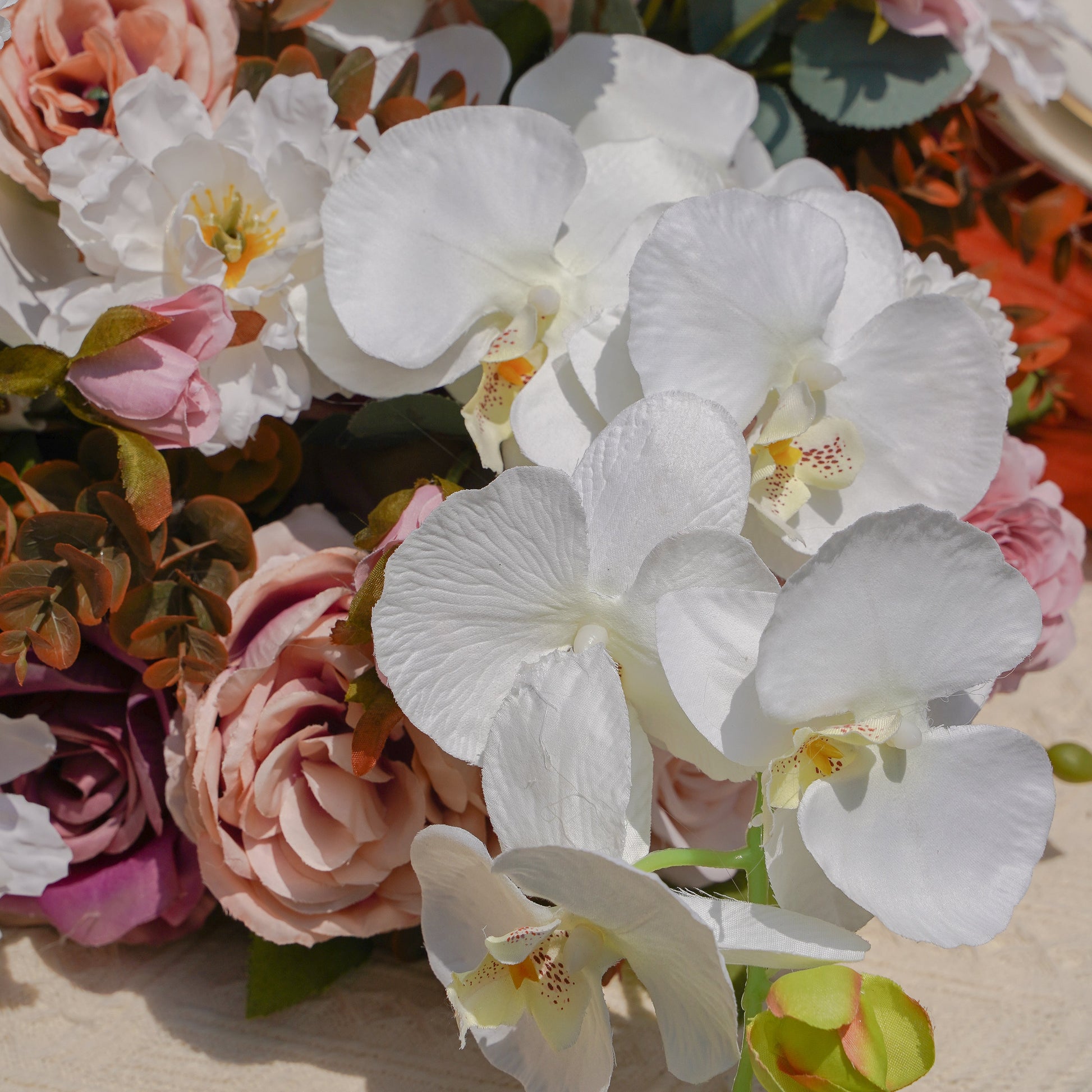 Close-up of white orchid blush rose and hydrangea runner