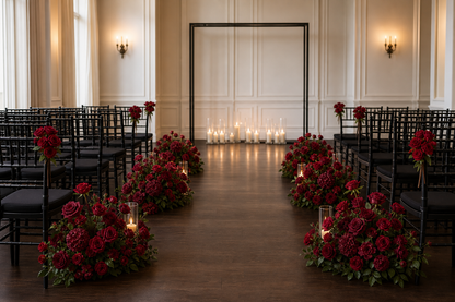 Burgundy red loose flower kit styled as wedding aisle and chair decorations