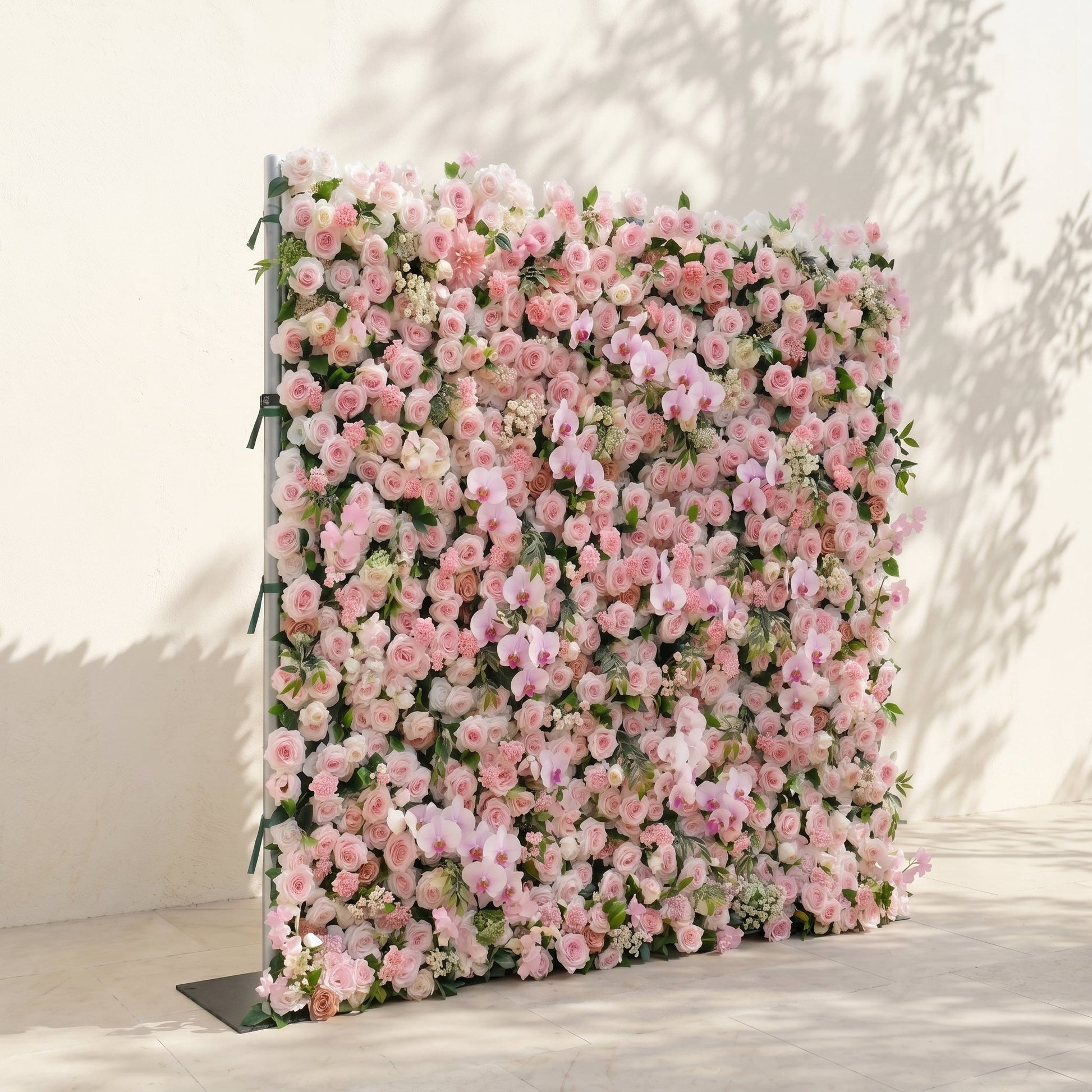 Left view of pink silk flower wall backdrop