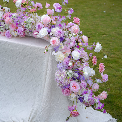Close-up of pink lavender and white artificial flower runner