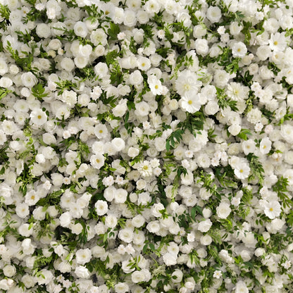 Ivory silk flower wall with greenery close-up detail