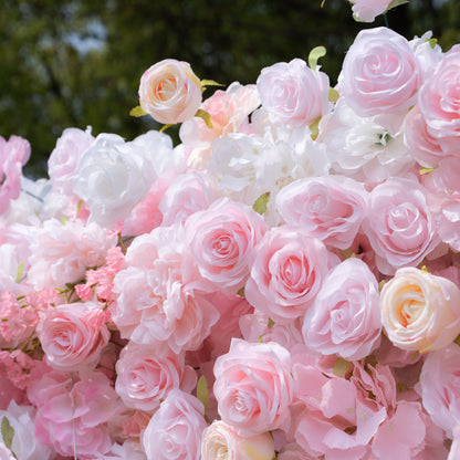 Close-up of pink and white silk flowers on the flower wall