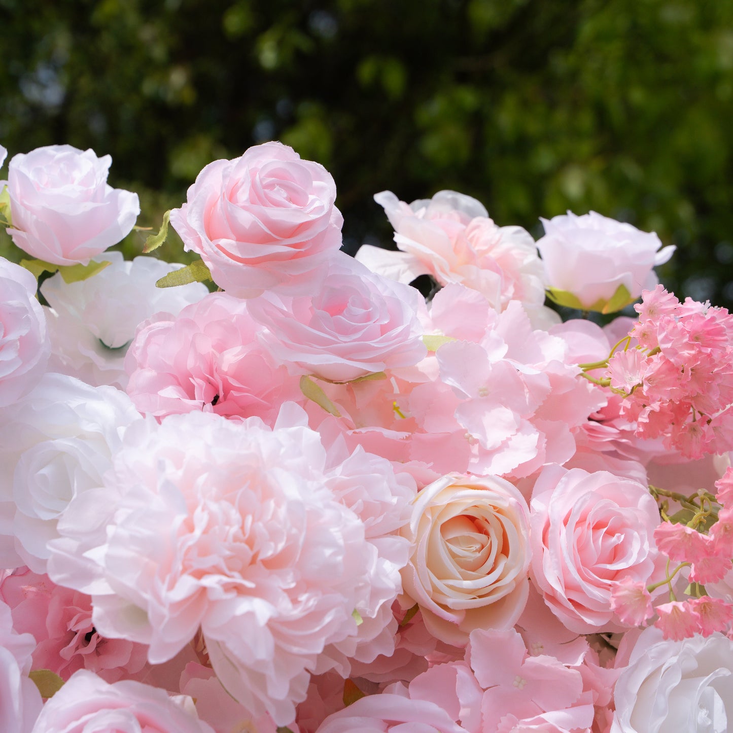 Detail of layered pink and white artificial roses