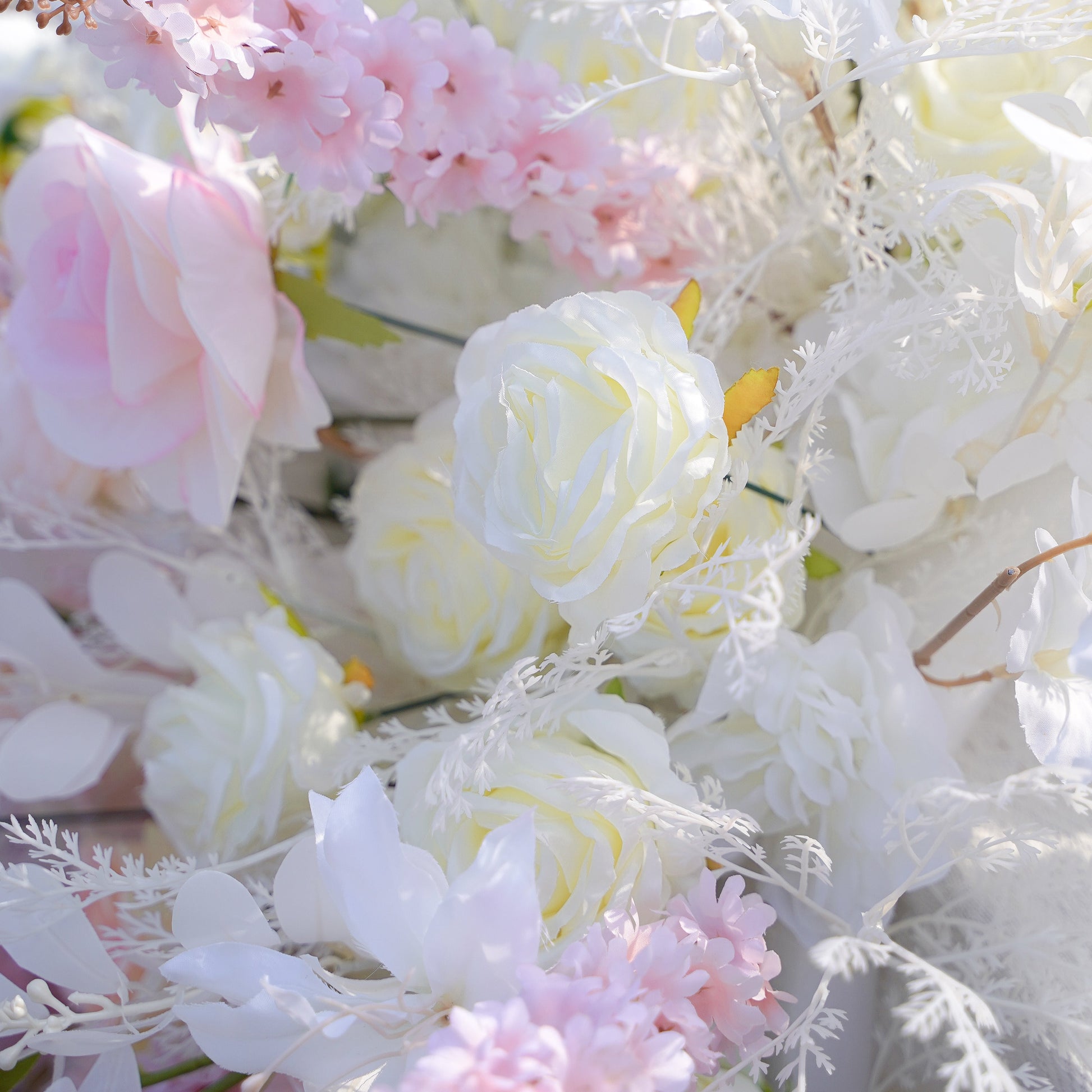 Cascading purple blush and warm beige wedding table flower runner