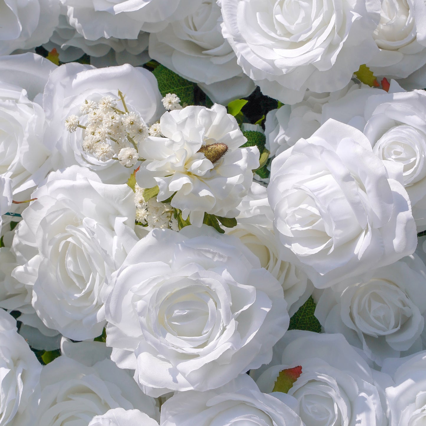 Close-up of white artificial roses and blossoms