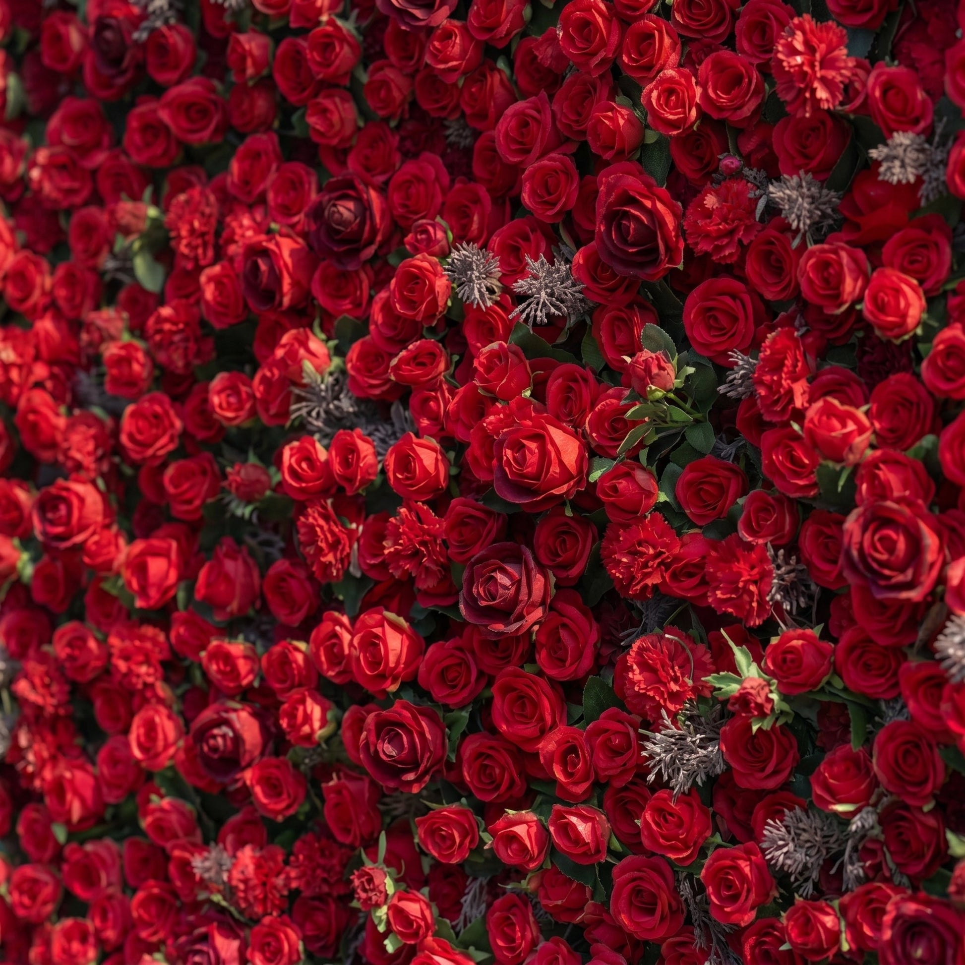 Red artificial rose flower wall close-up detail
