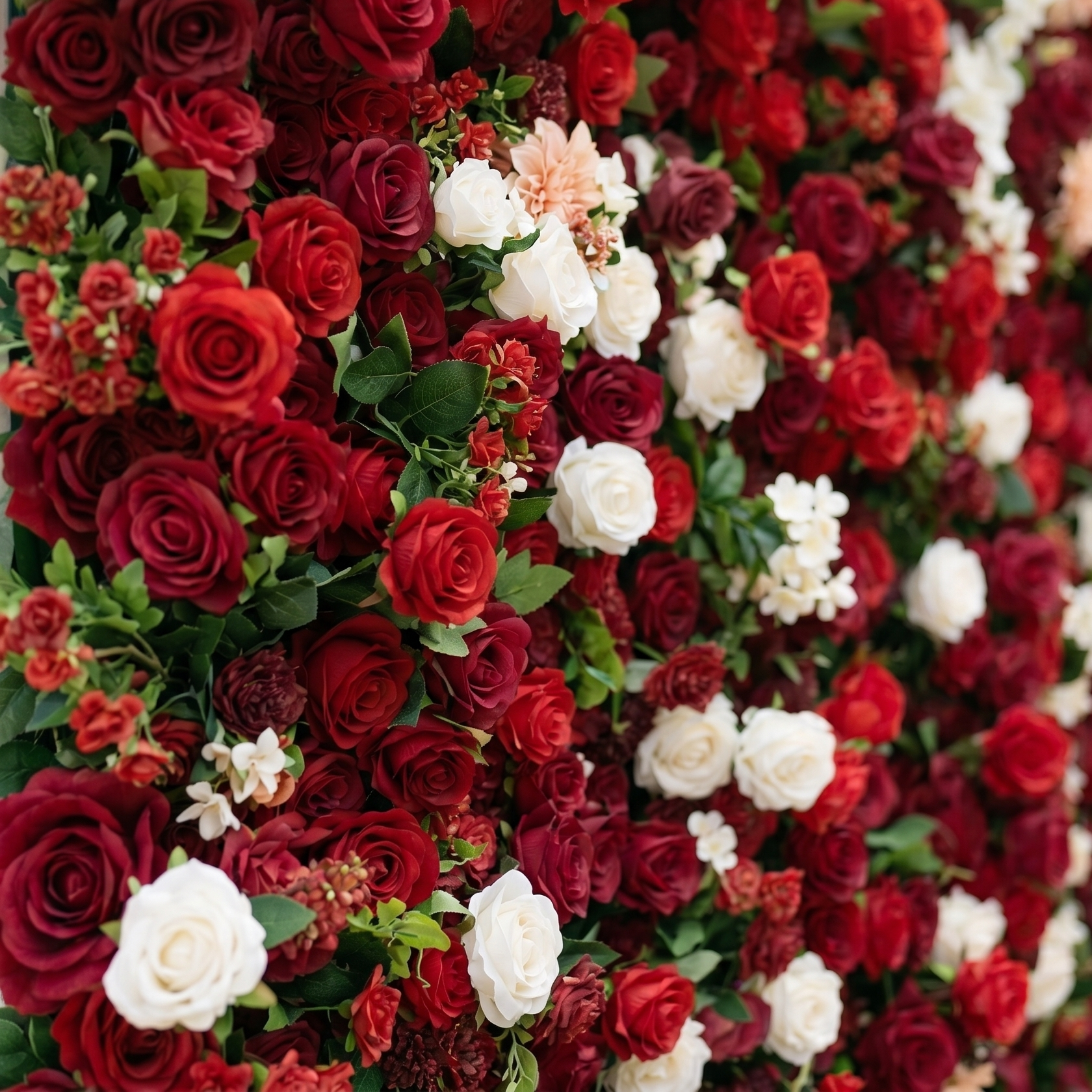 Side detail showing layered artificial flowers on Isla flower wall