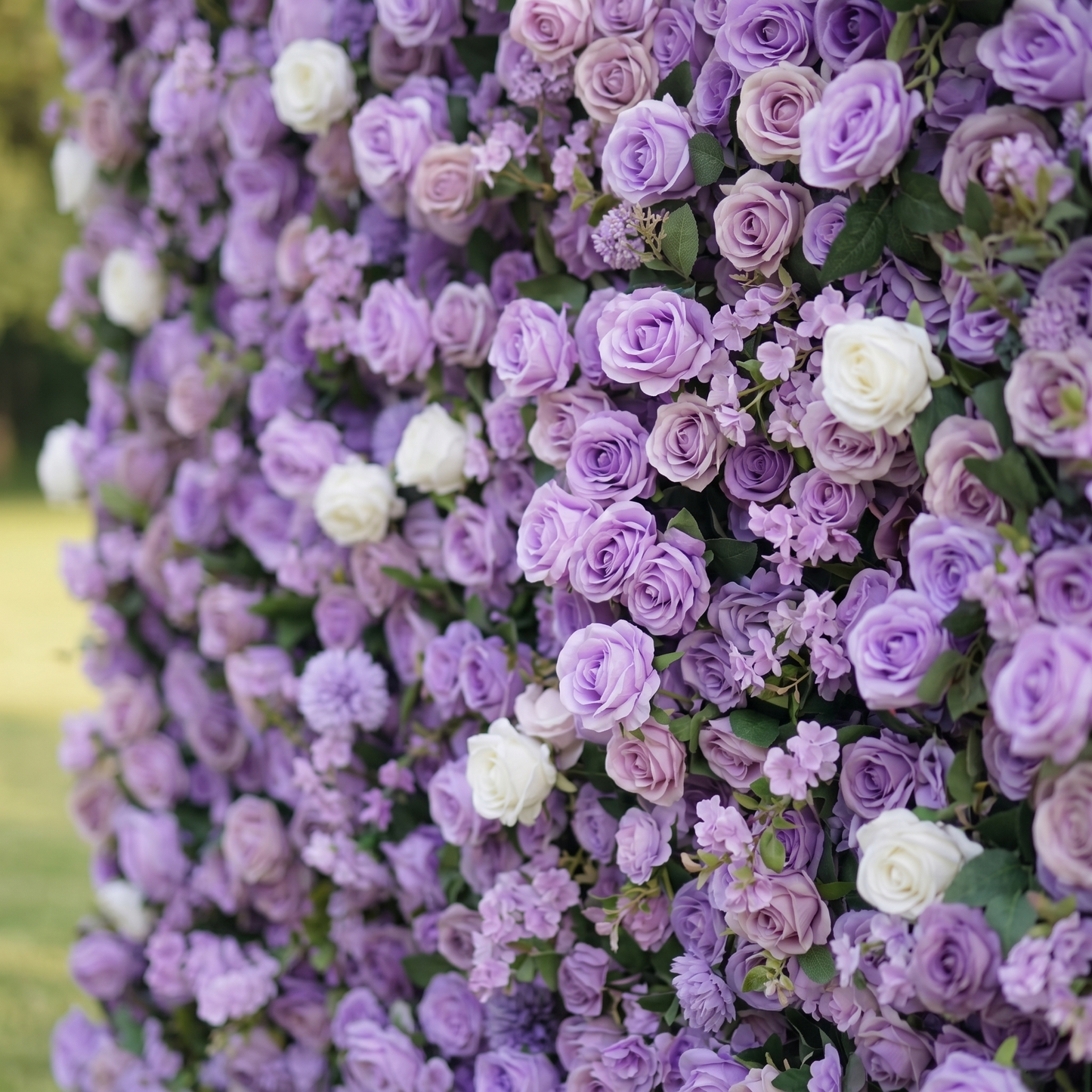 Layered side detail of purple rose artificial flower wall