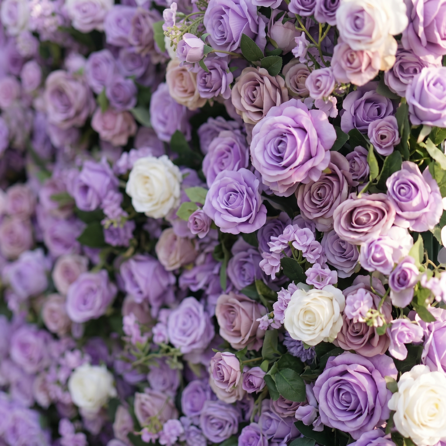 Dimensional detail of lavender purple and ivory roses