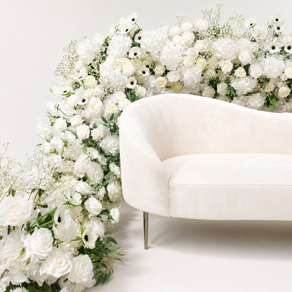 White rose hydrangea and anemone artificial flower runner styled around a cream chair
