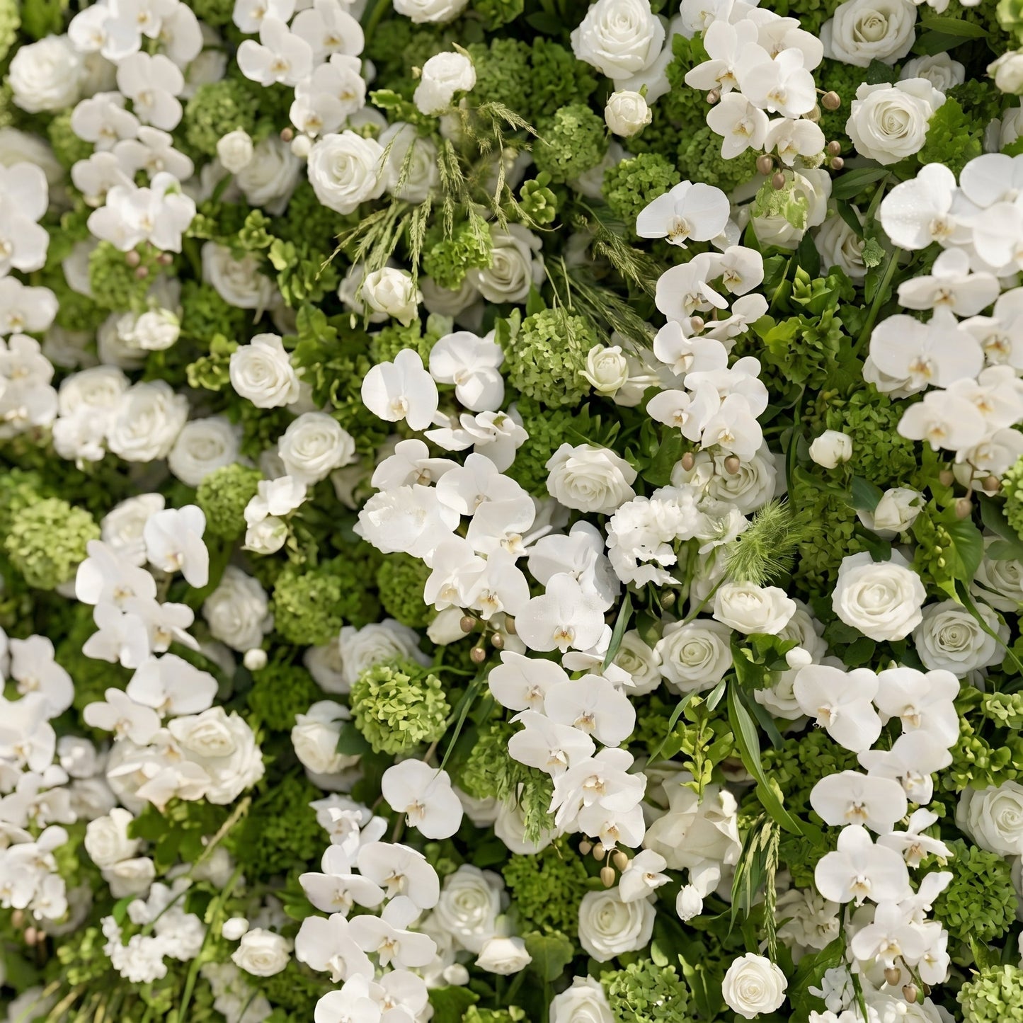 White floral wall with greenery close-up detail