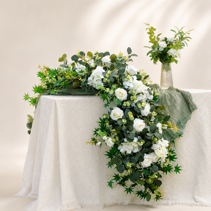 White hydrangea and eucalyptus artificial flower runner in a warm white studio