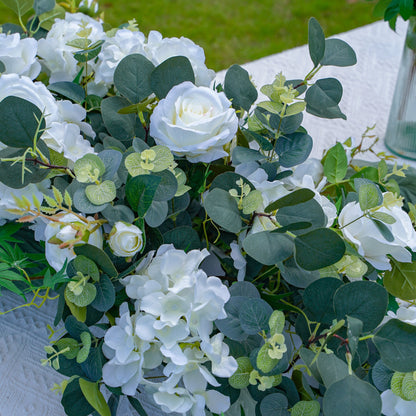 Close-up of white hydrangea rose and eucalyptus artificial flower runner