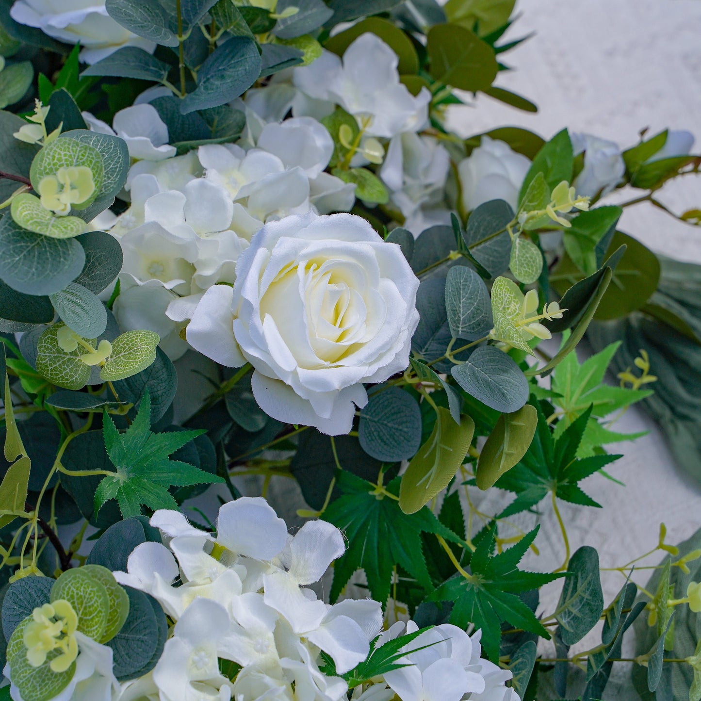 Realistic white artificial flower runner detail for wedding tables