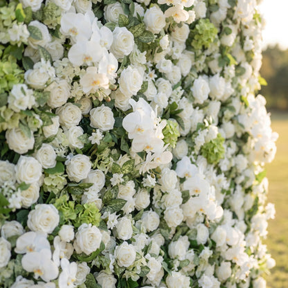 White rose orchid and greenery flower wall close-up