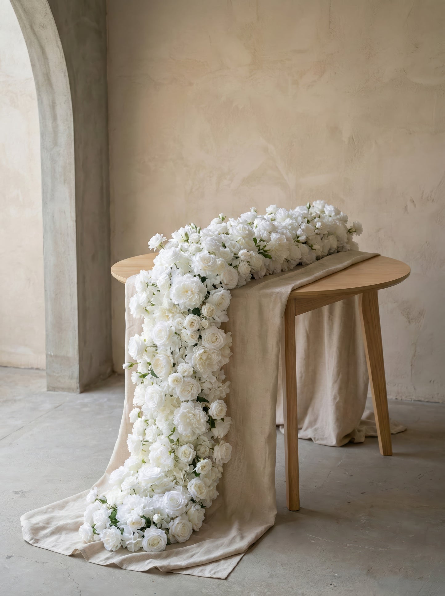 Long white rose and peony artificial flower runner in a warm neutral studio