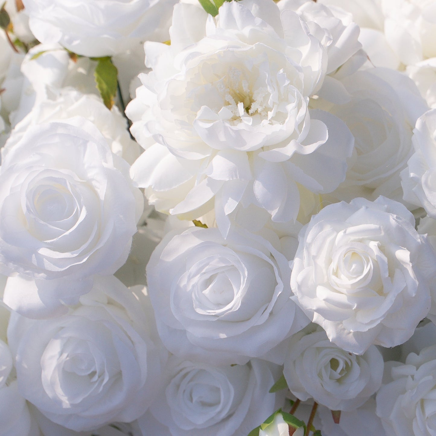 Close-up of white rose and peony artificial flower runner